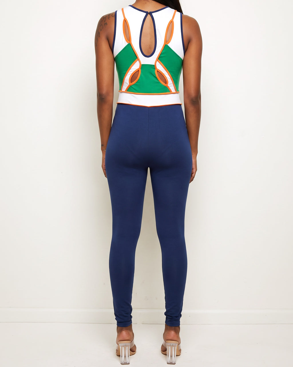 Blue multicolor color block cut-out jumpsuit, back view on model