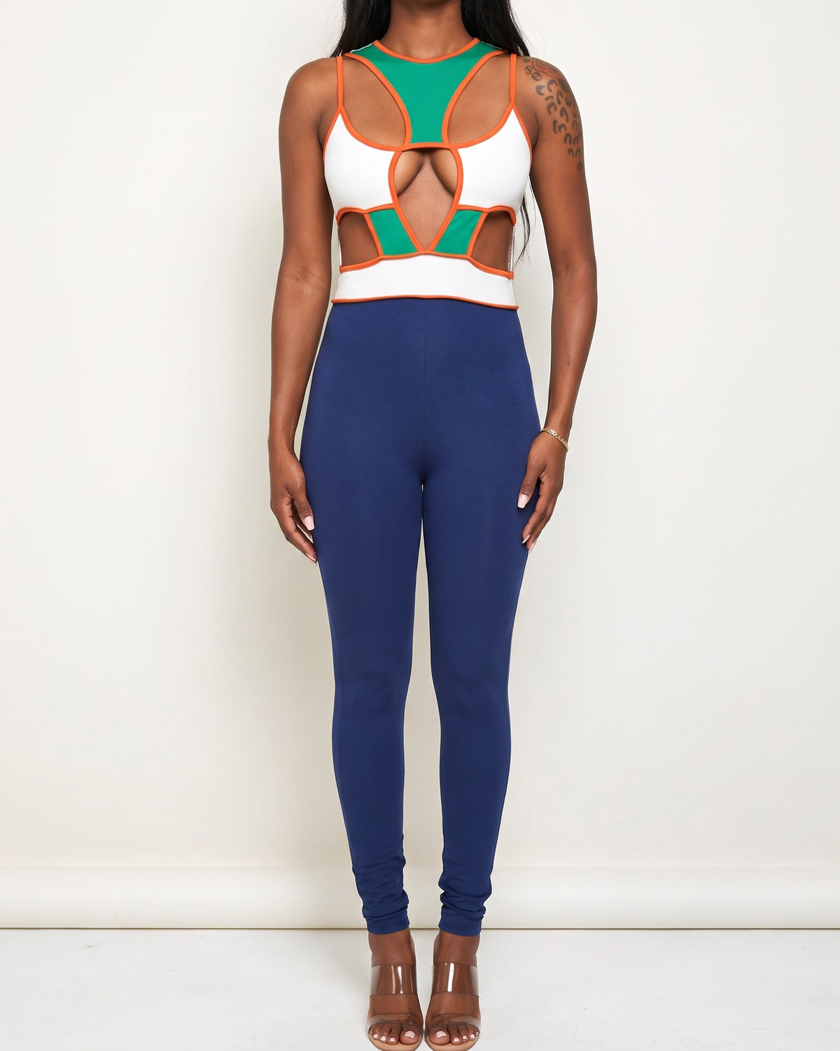 Blue multicolor color block cut-out jumpsuit, alternate front view on model