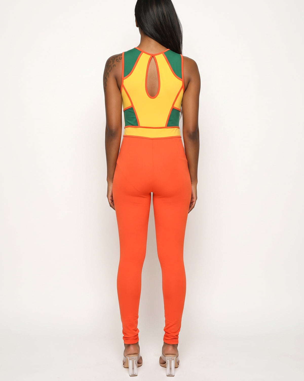 Orange multicolor color block cut-out jumpsuit, back view on model