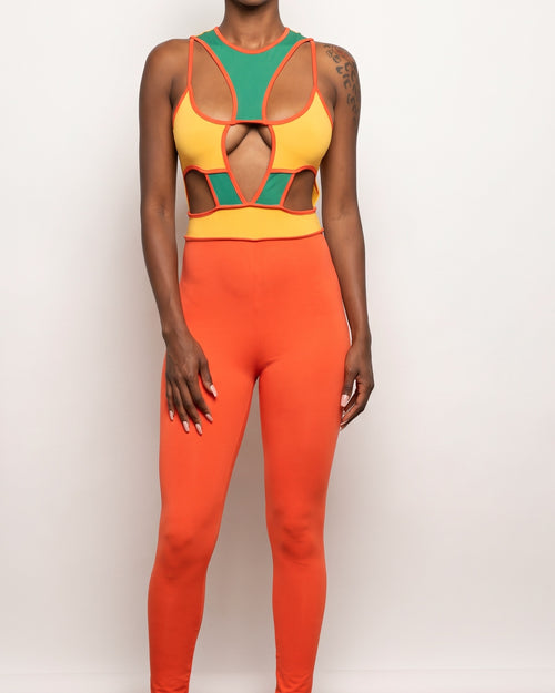 Orange multicolor color block cut-out jumpsuit, alternate front view on model