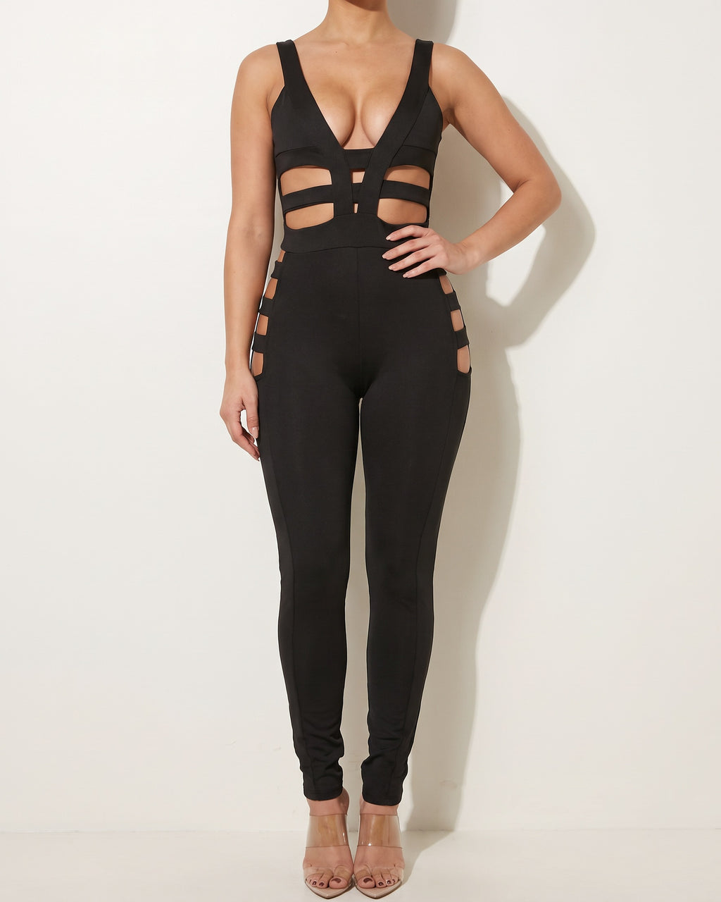 Black cut-out line jumpsuit, alternate front view on model