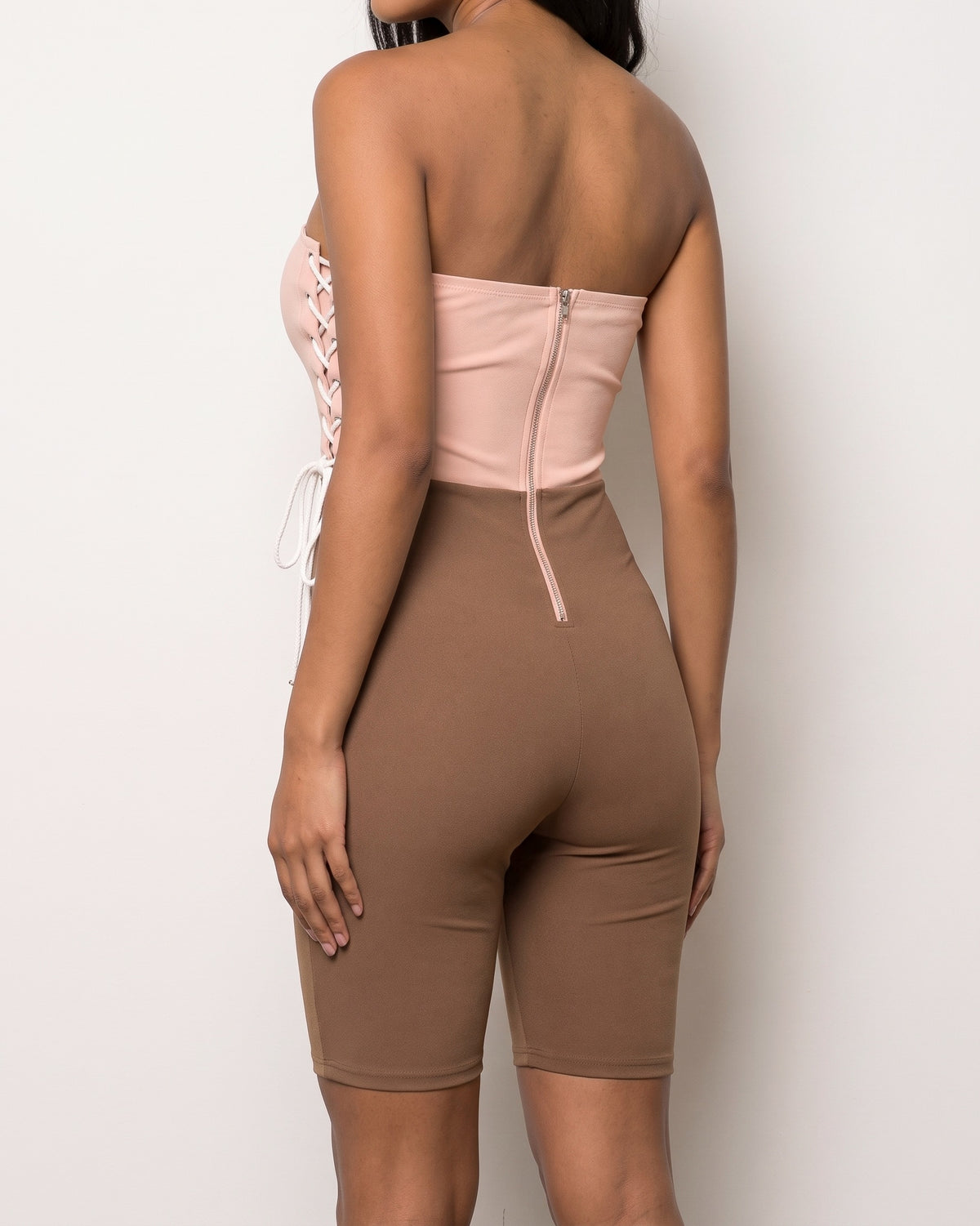 Brown and taupe strappy detailed tube romper, back view on model