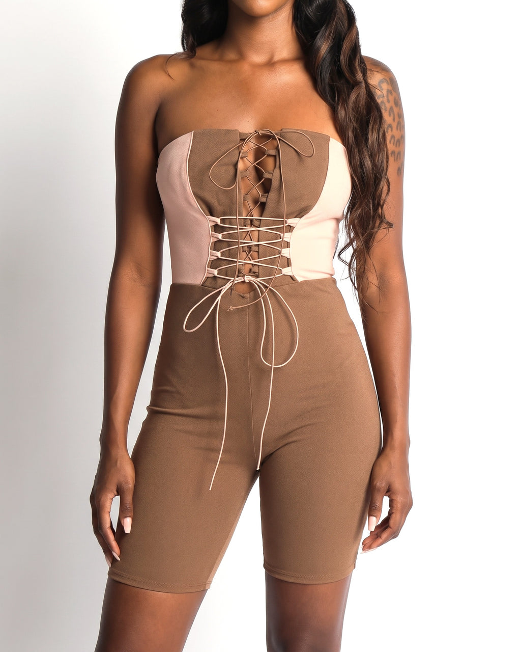 Muvin women's brown and taupe strappy detailed tube romper, front view on model
