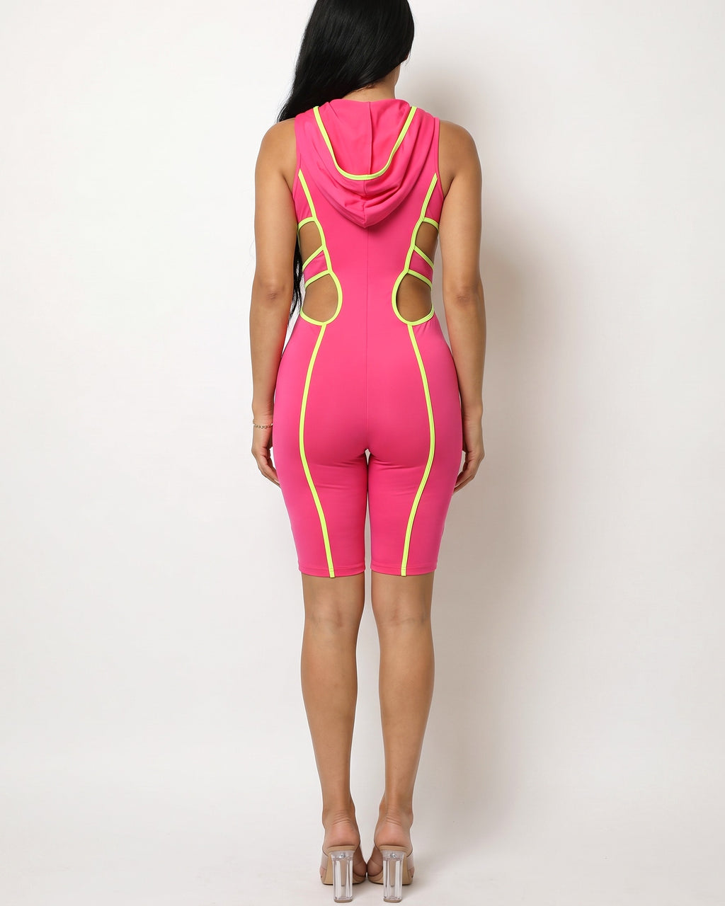 Fuchsia and neon lime semi zip-up spaghetti line hoodie romper, back view on model