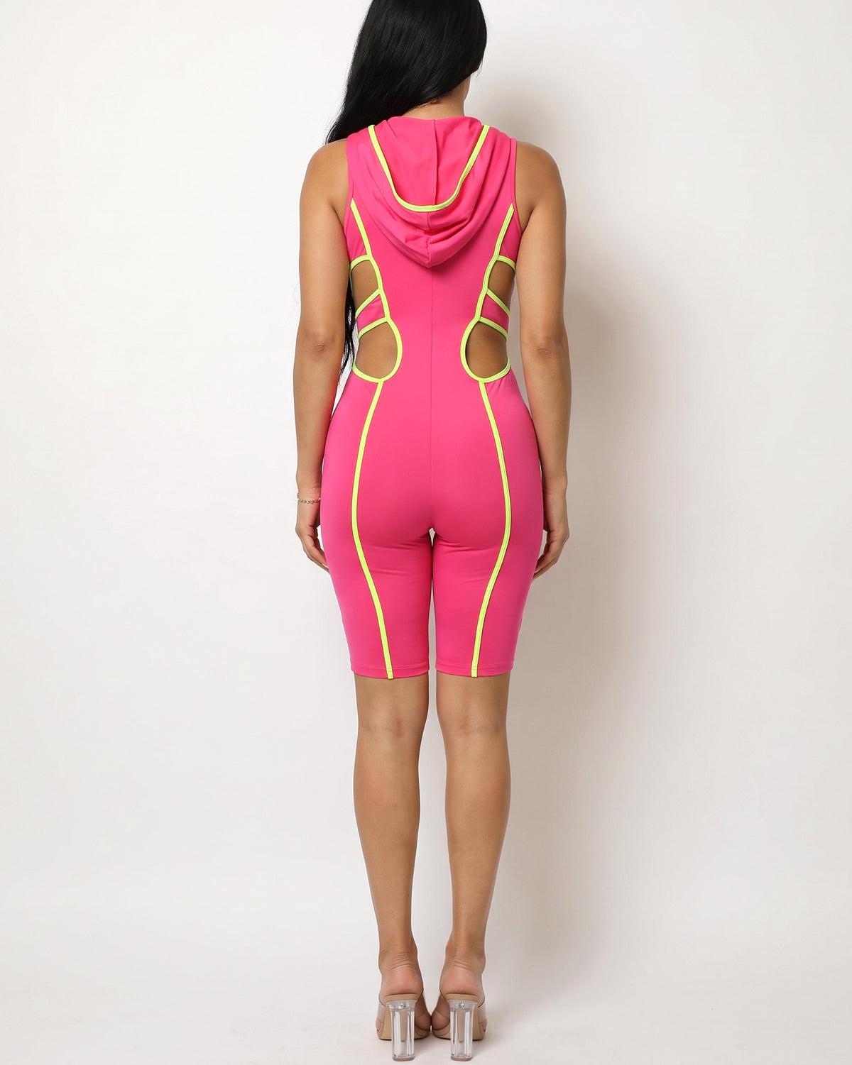 Fuchsia and neon lime semi zip-up spaghetti line hoodie romper, back view on model