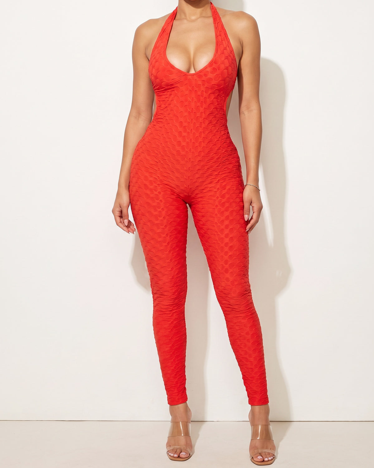 Muvin women's red halter neck jumpsuit, front view on model
