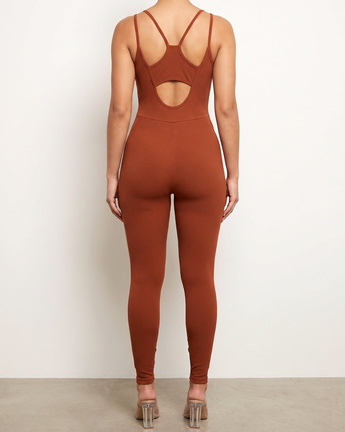 Brown double spaghetti strap back cut out jumpsuit, back view on model
