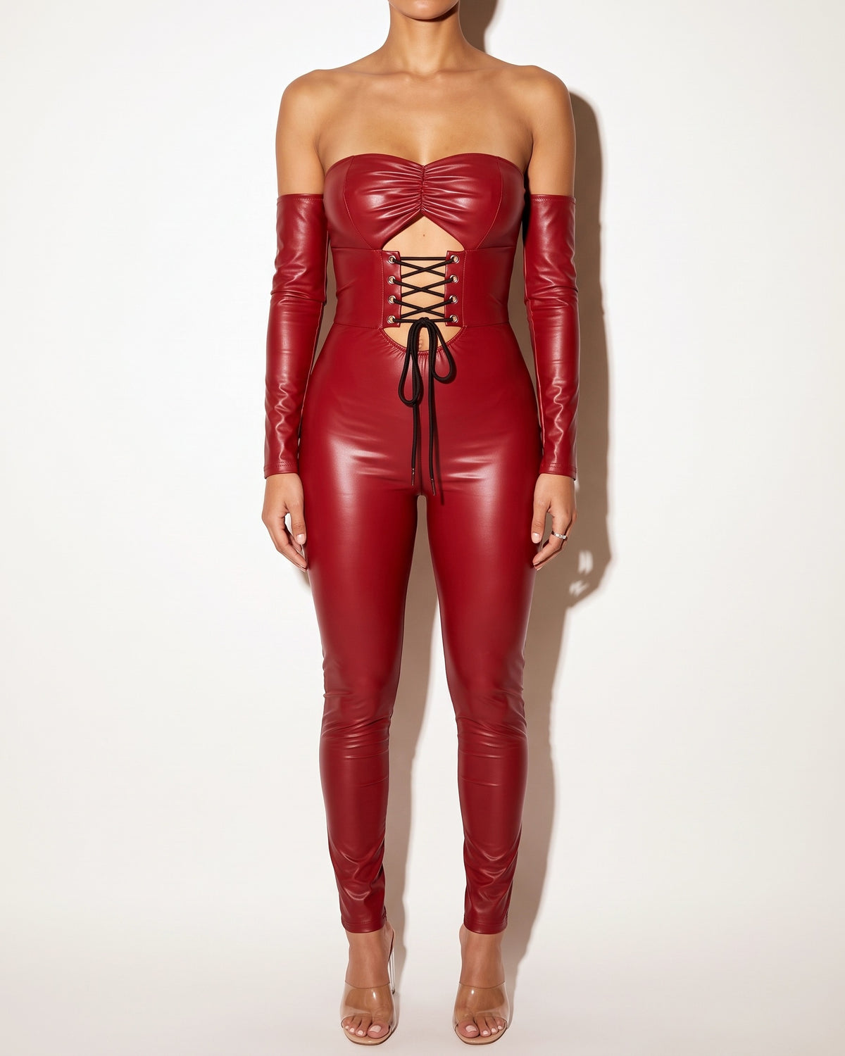 Muvin women's dark red lace up off shoulder PU jumpsuit, front view on model