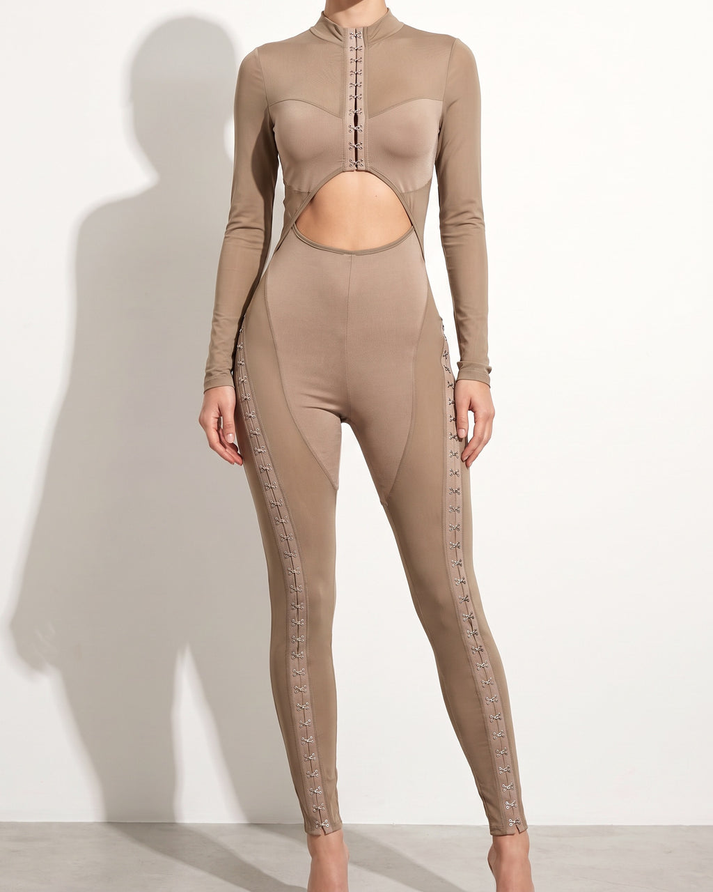 Muvin women's taupe front hook and eye jumpsuit, front view on model