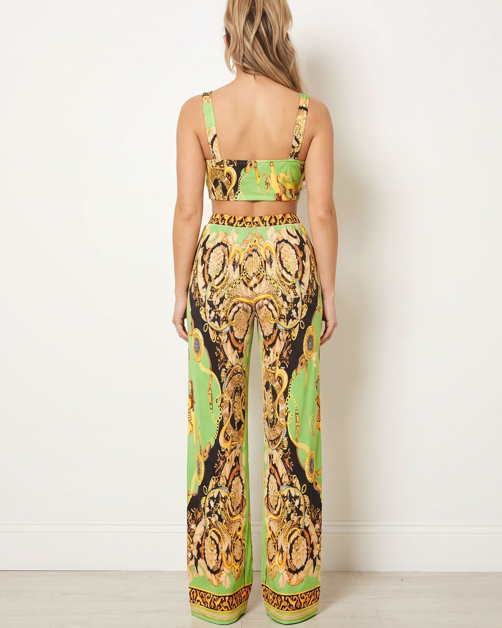Green combo printed crop top and pants set, back view on model