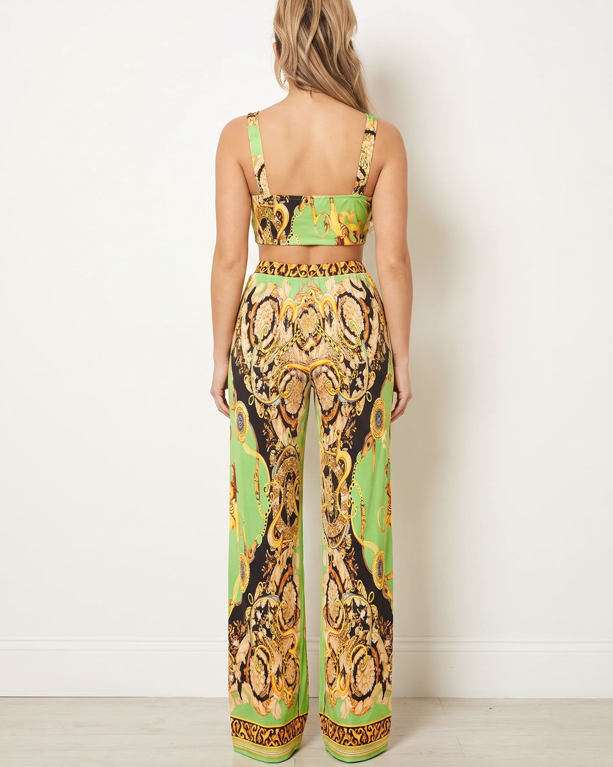 Green combo printed crop top and pants set, back view on model