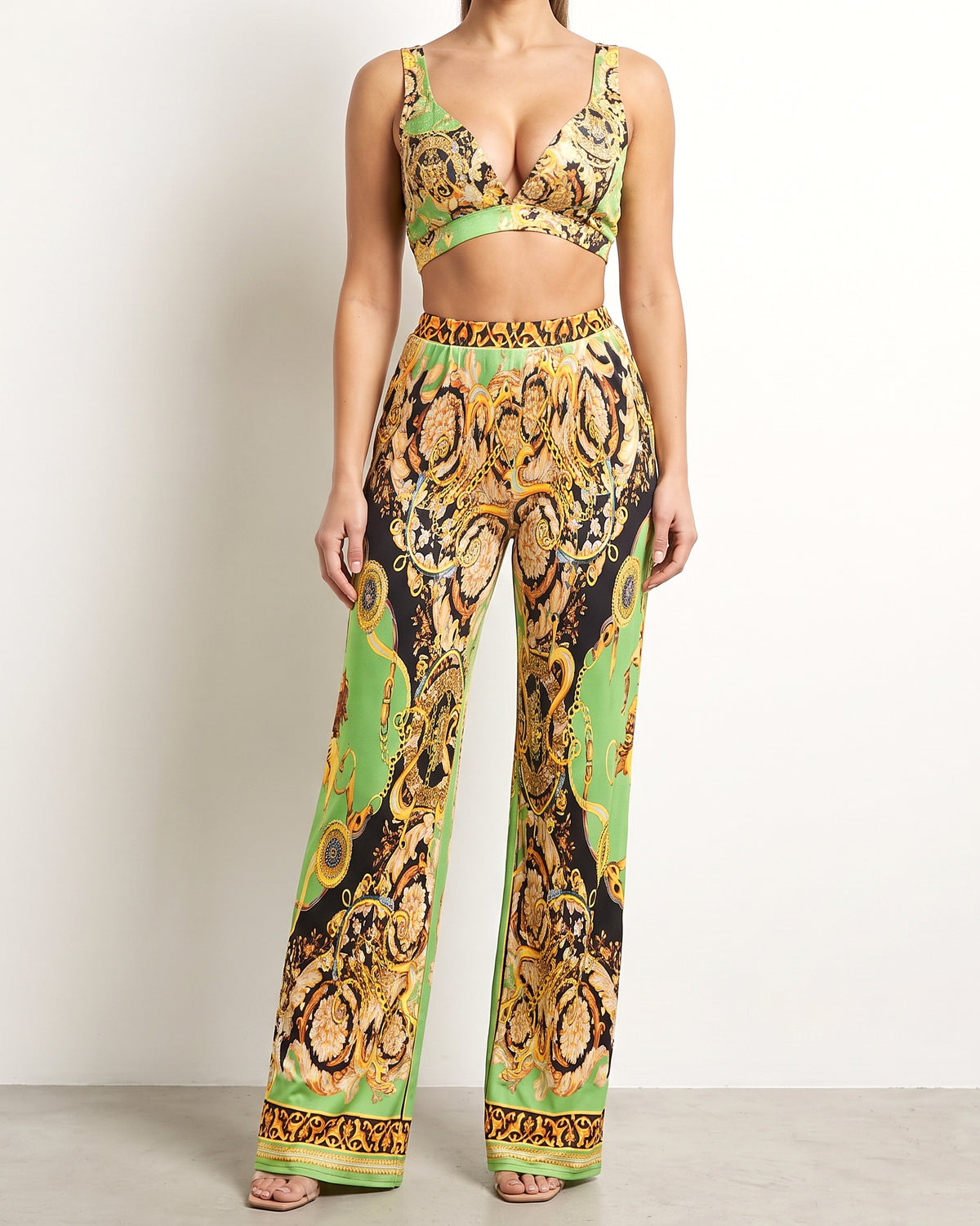 Muvin women's green combo printed crop top and pants set, front view on model