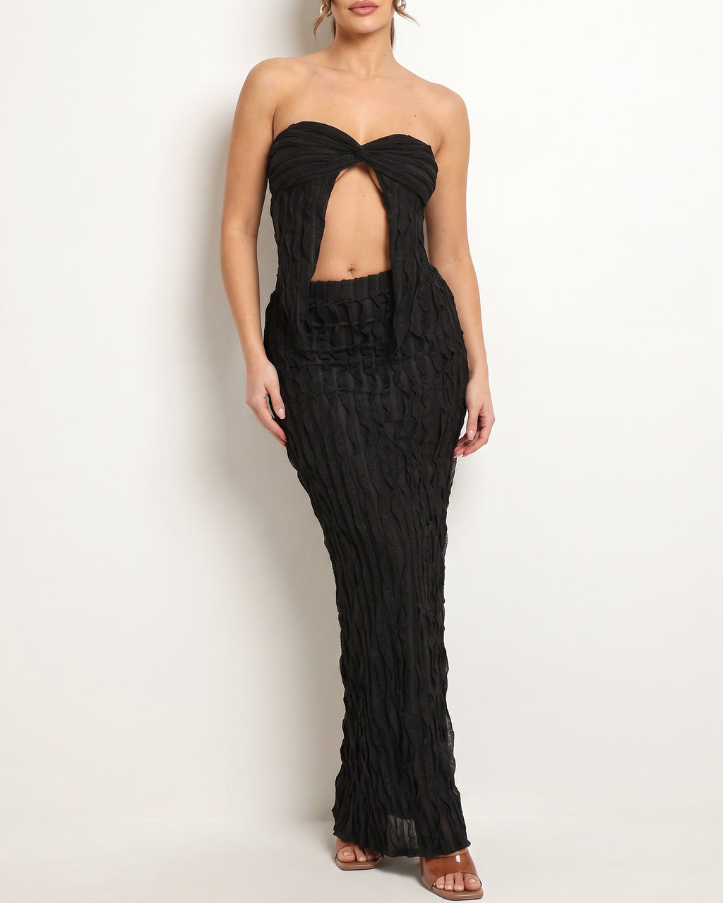 Black ruffle designed skirt set, front view on model