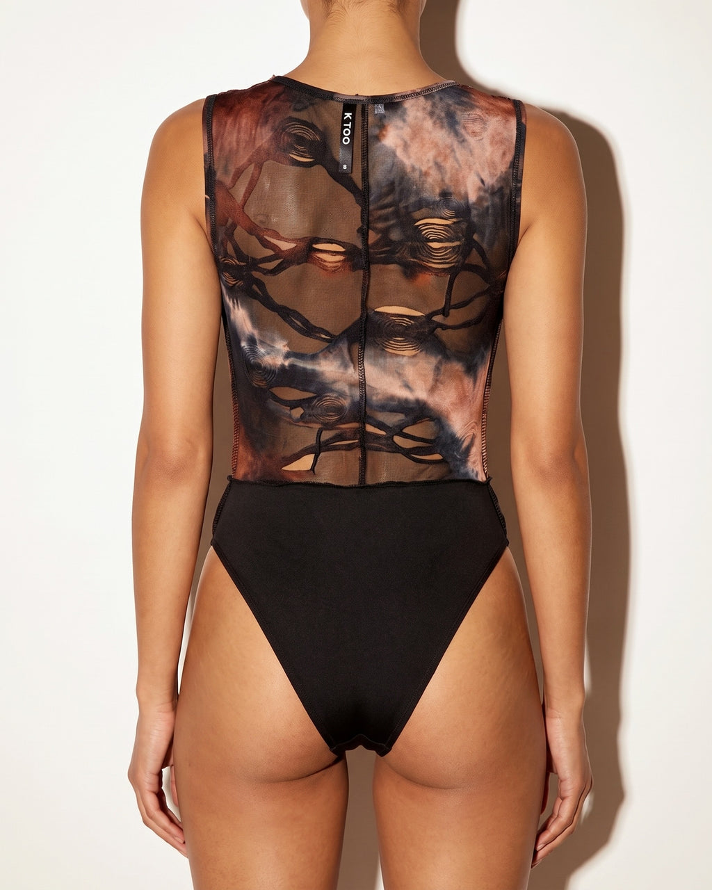 Brown combo just my vibe distressed bodysuit, back view on model