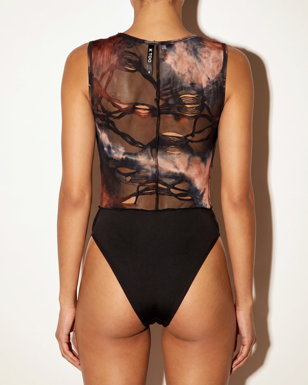 Brown combo just my vibe distressed bodysuit, back view on model