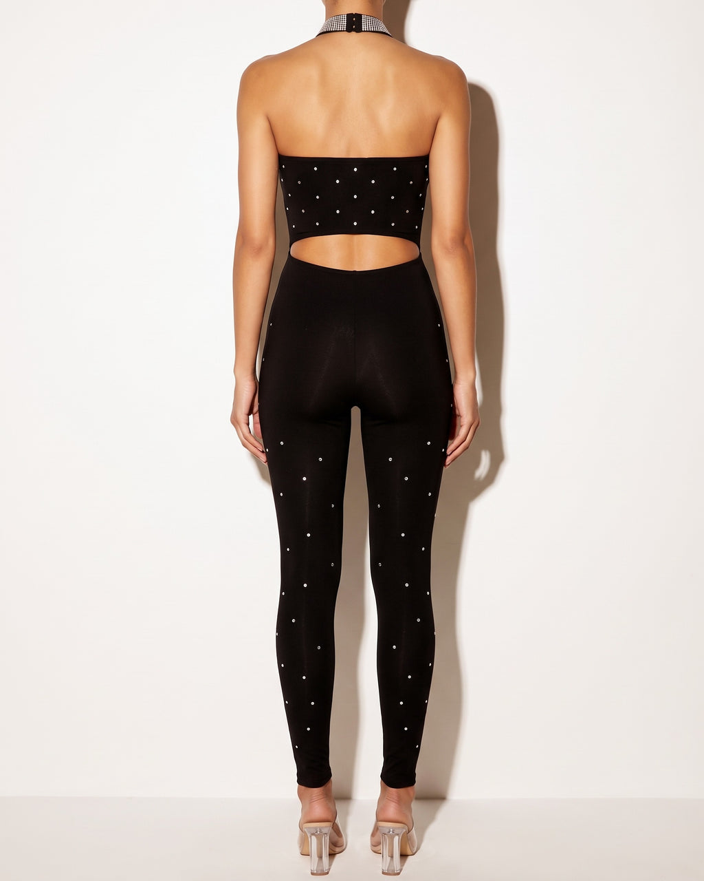 Black choker tube jumpsuit, back view on model