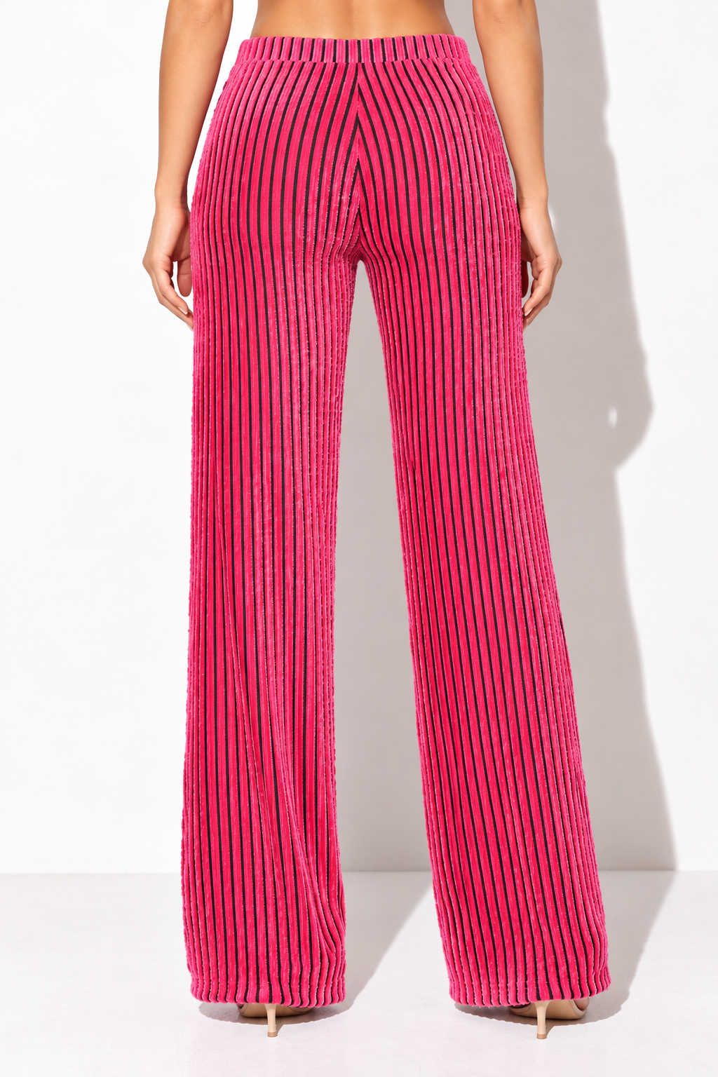 Pink and black striped wide leg pants, rear view showing continuous vertical stripes and center seam