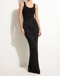 Muvin women's black laser cut maxi skirt with tie dye print mesh lining, front view on model