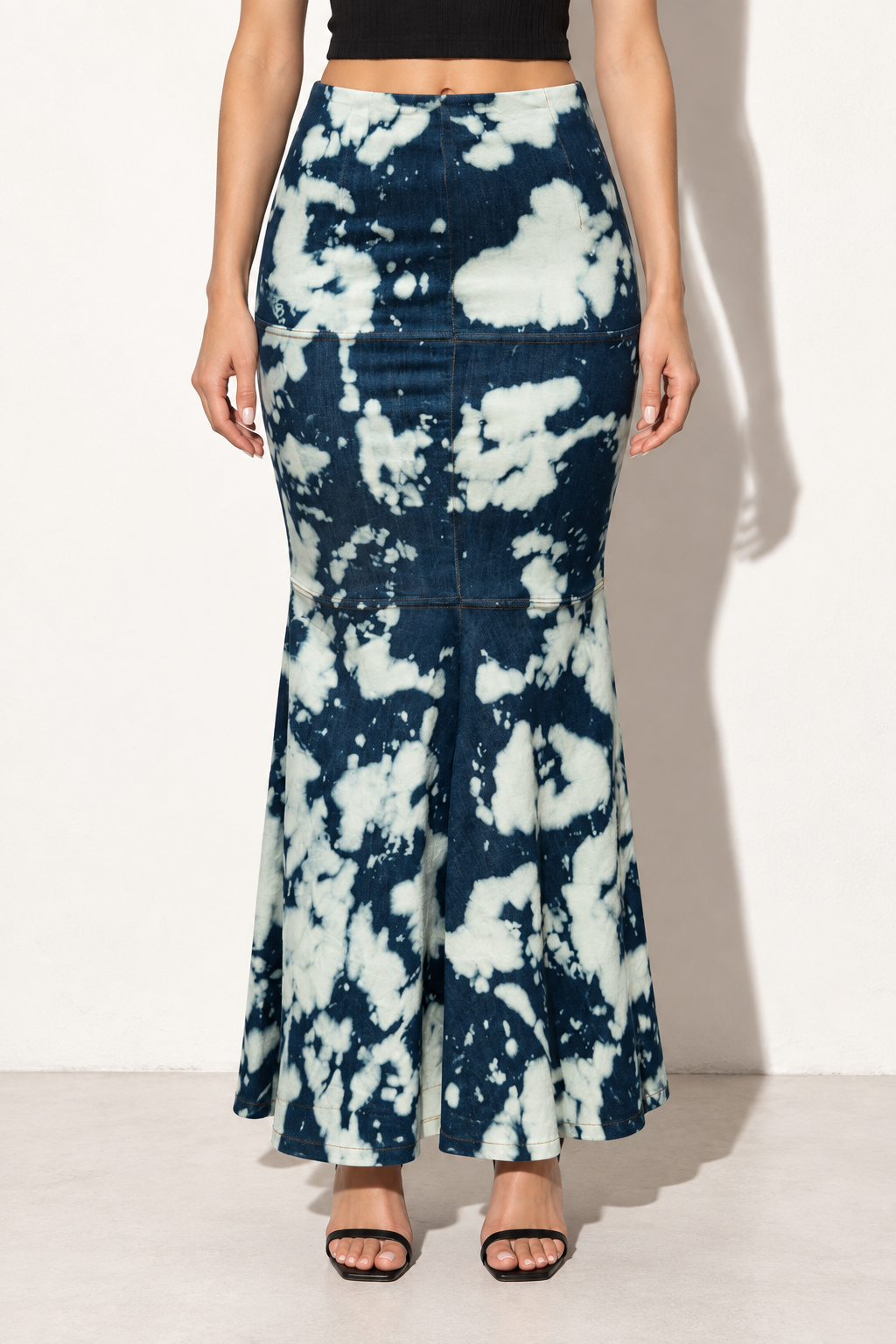Muvin women's acid wash indigo and cream denim mermaid maxi skirt, front view showing panel seams and flared hem