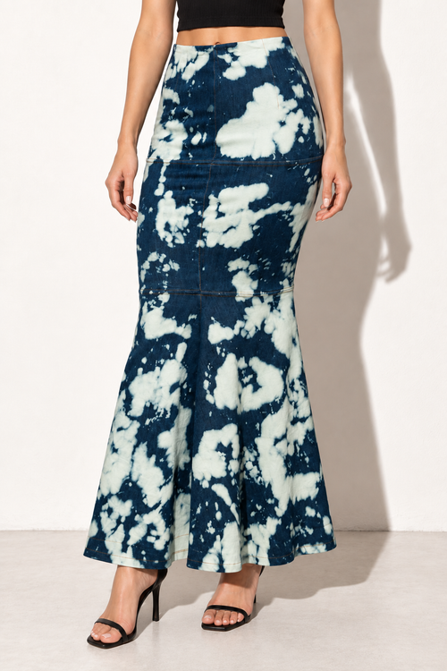 Acid wash indigo and cream denim mermaid maxi skirt, angled front view showing fitted silhouette and acid wash pattern