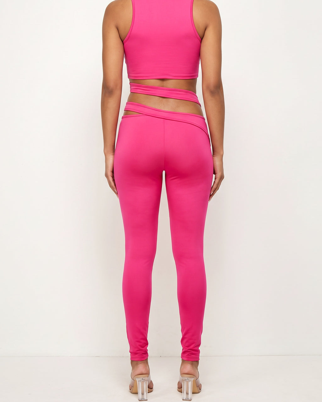 Fuchsia cutout detailed halter crop top set, back view on model