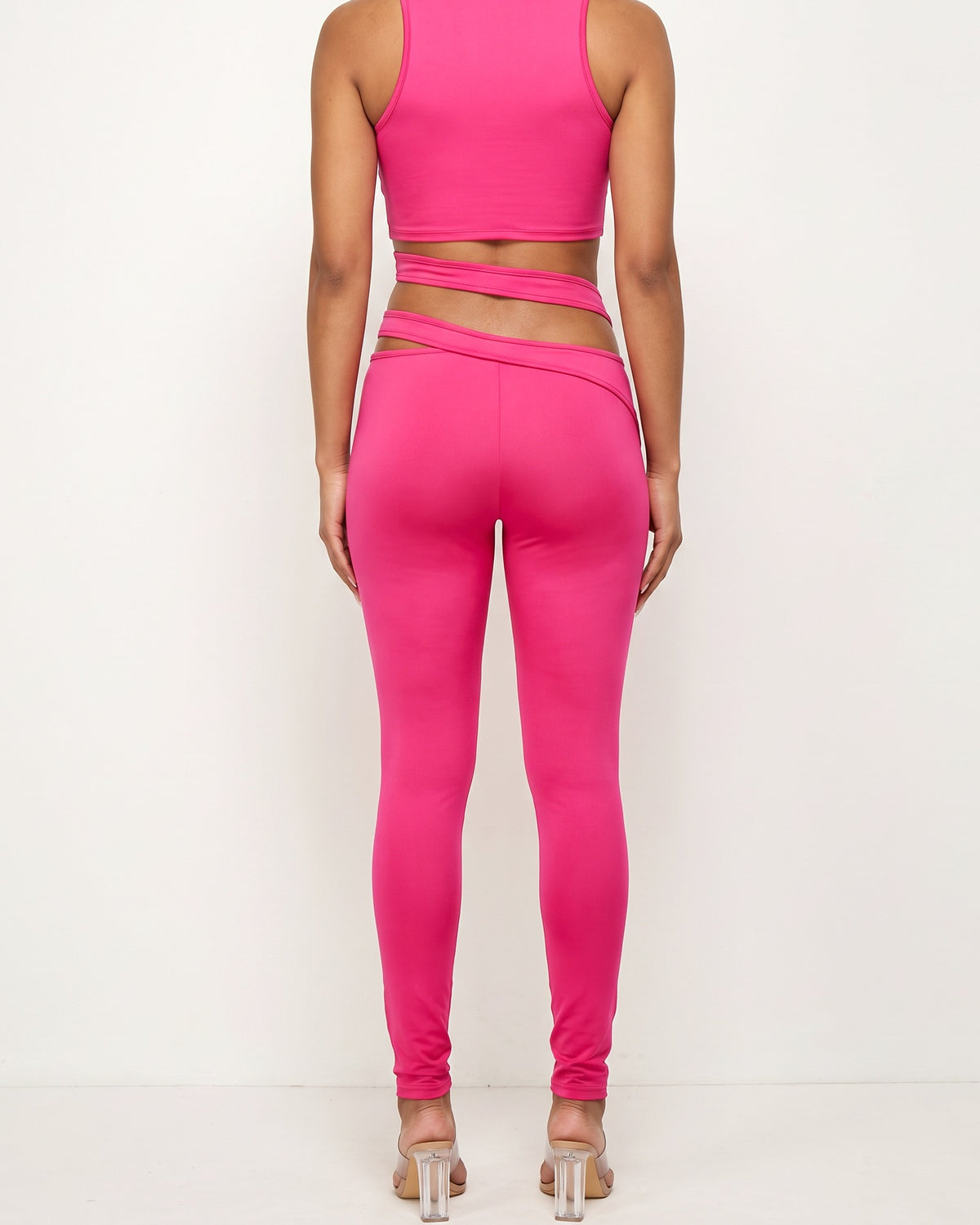 Fuchsia cutout detailed halter crop top set, back view on model