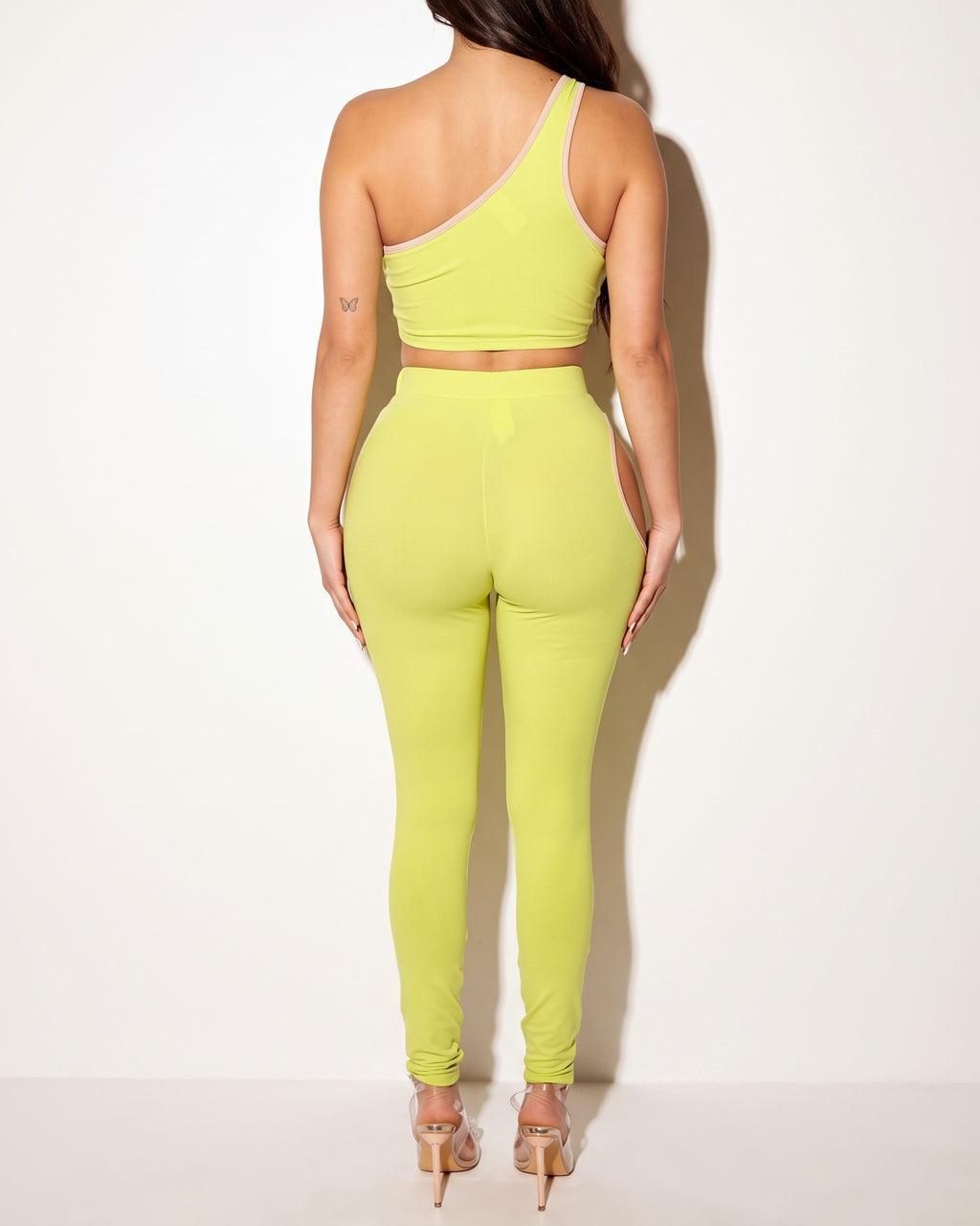 Citrus and nude cutout detailed tank and legging set, back view on model
