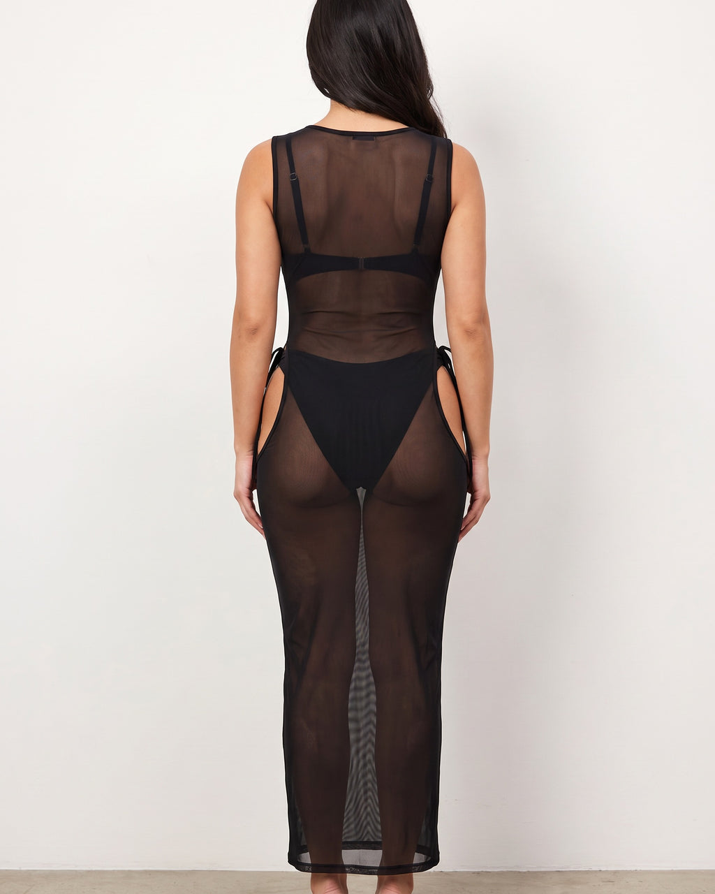 Black mesh cover up dress, back view on model