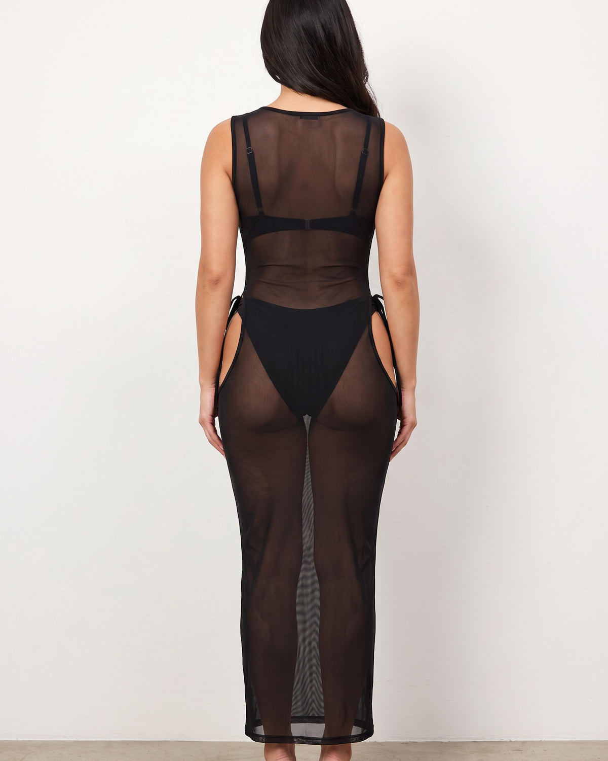 Black mesh cover up dress, back view on model