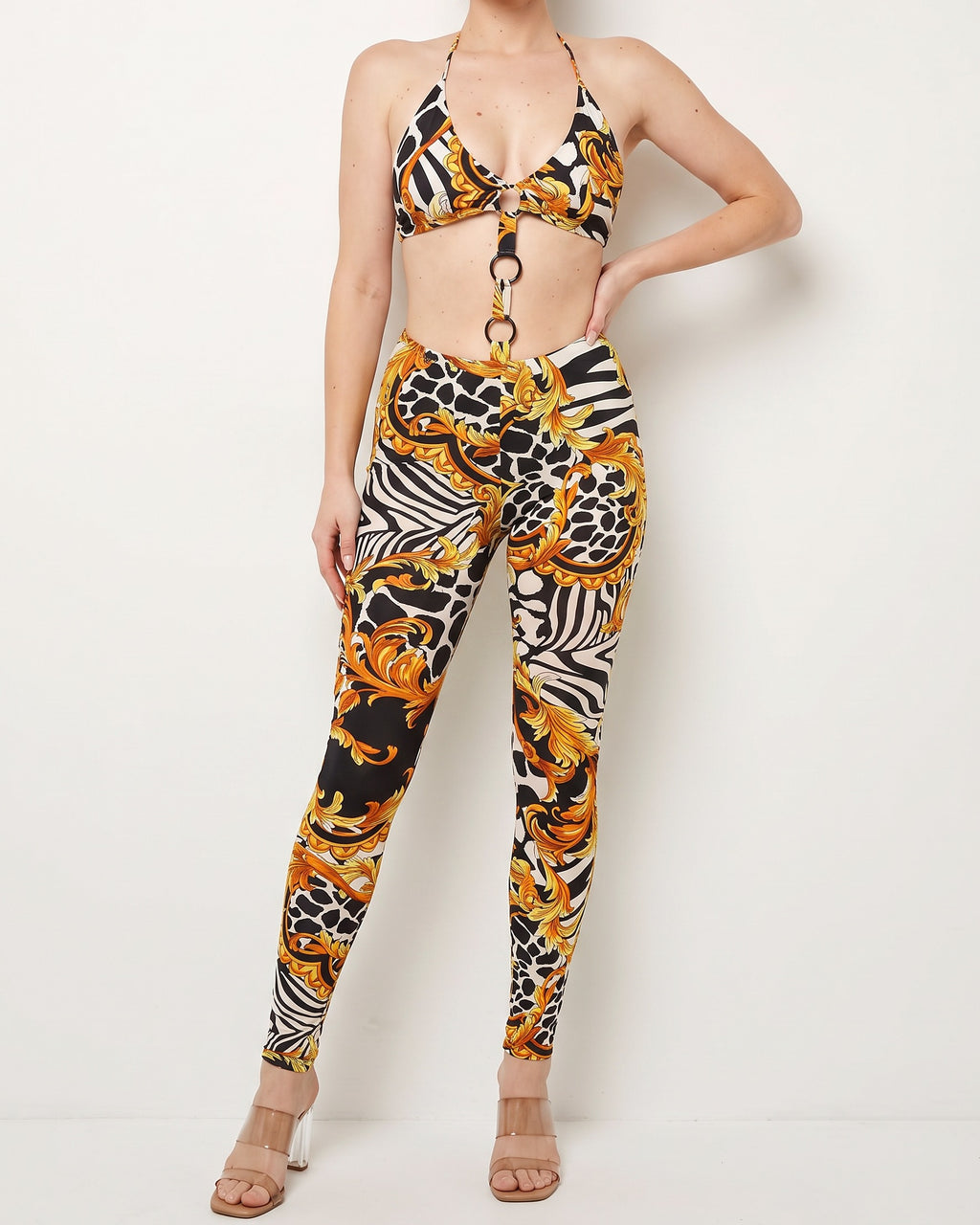 Muvin women's black yellow o ring detailed halter neck jumpsuit, front view on model