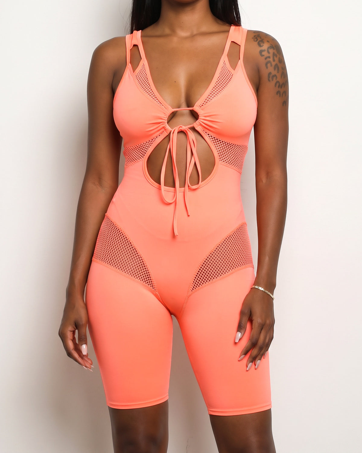 Coral fishnet detailed romper, alternate front view on model