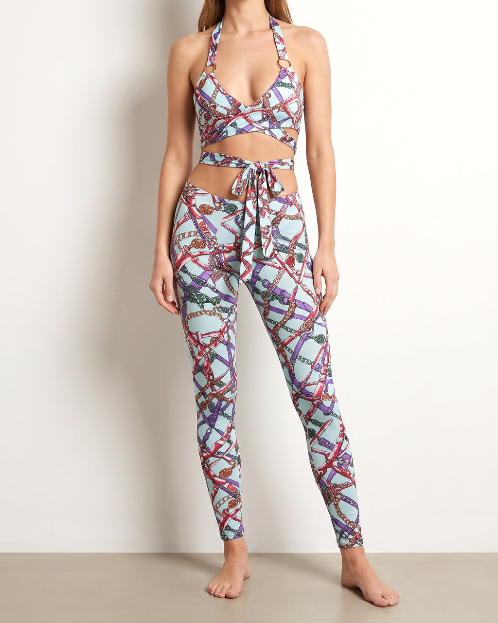 Muvin women's aqua combo printed tie detailed jumpsuit, front view on model