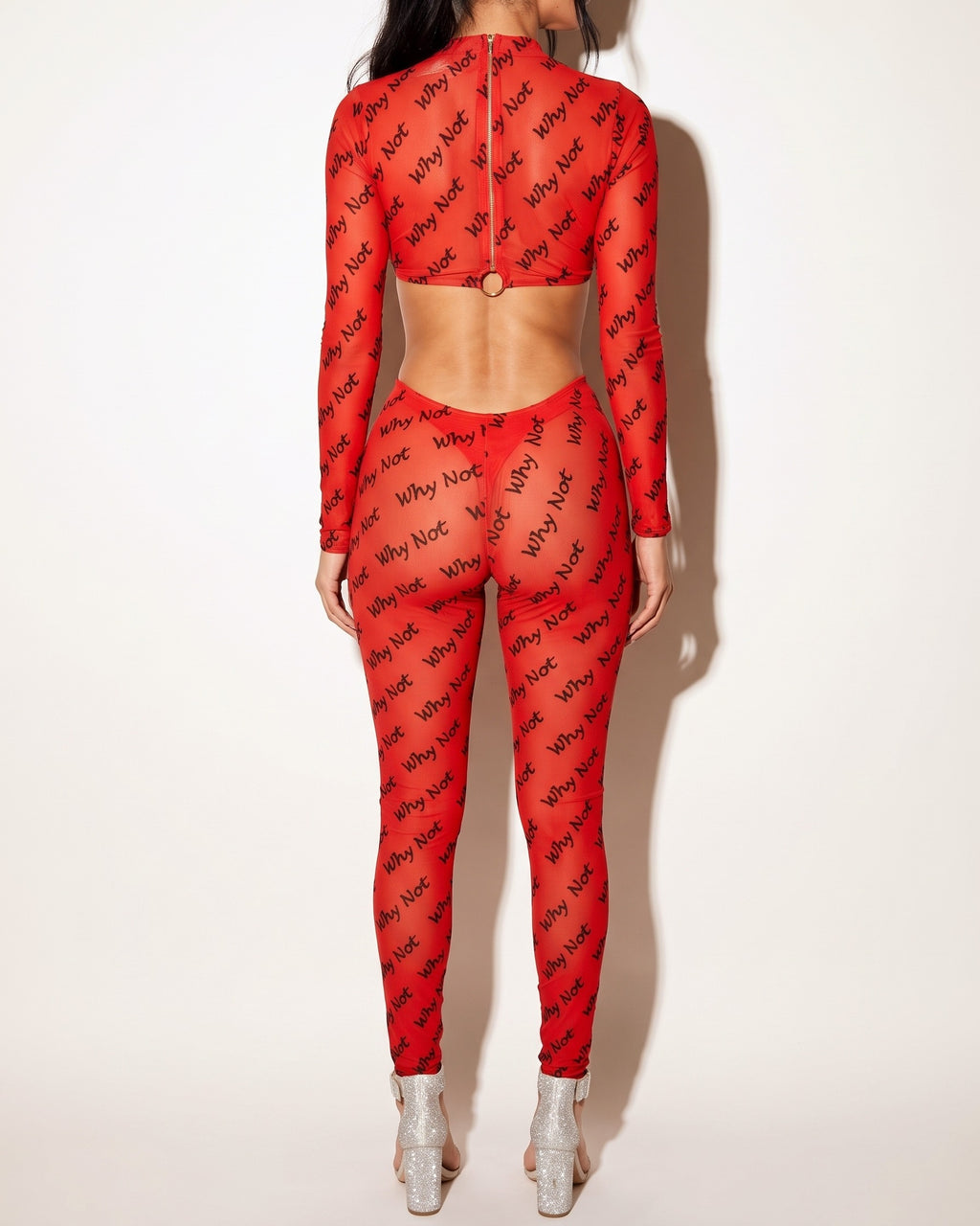 Red lettering mesh cut out double o-ring jumpsuit, back view on model