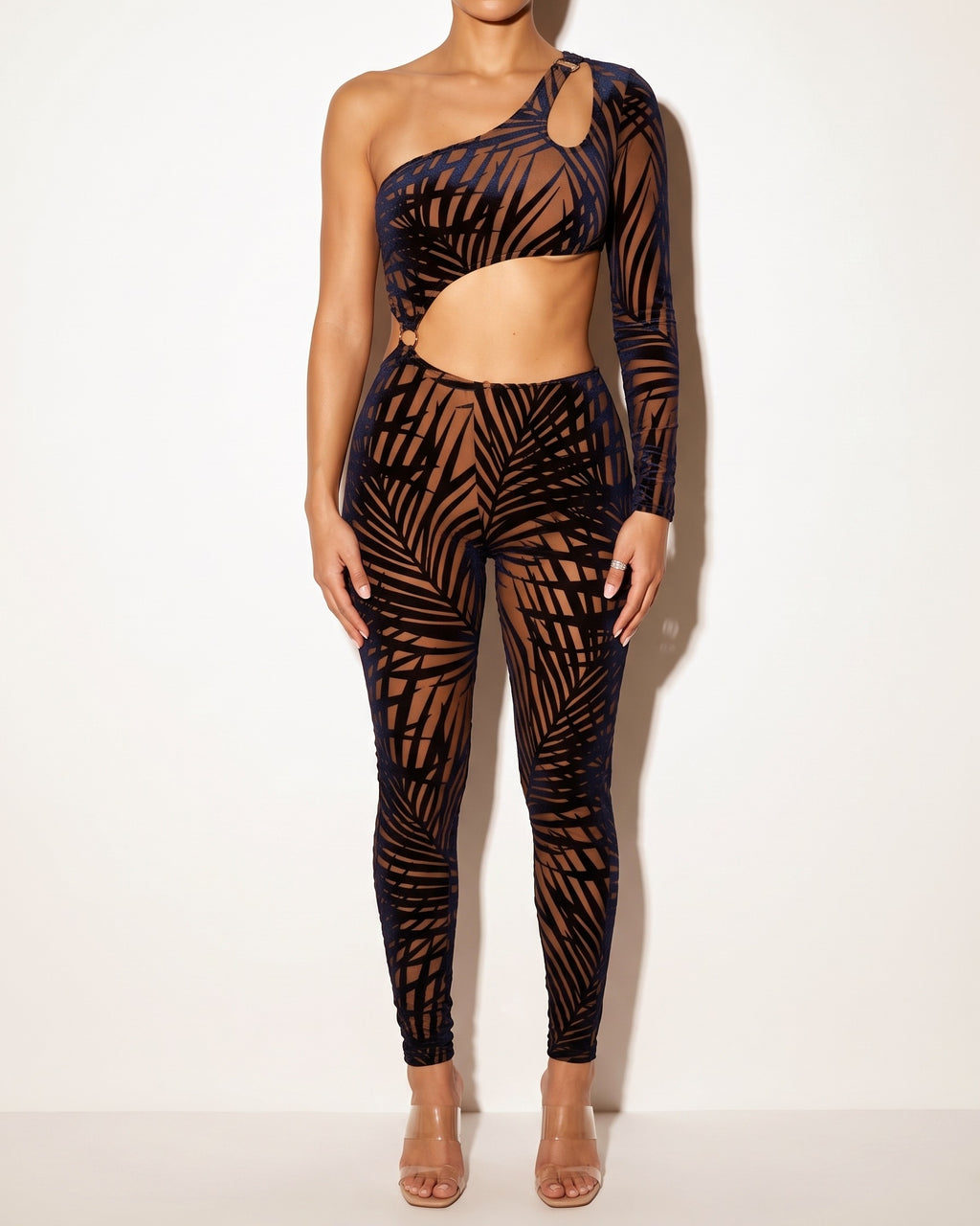 Muvin women's mocha and navy tropical leaf silhouette one sleeve jumpsuit, front view on model