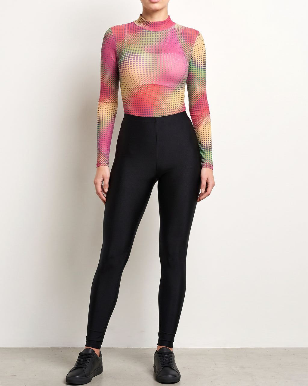 Muvin women's pink combo printed bodysuit, front view on model