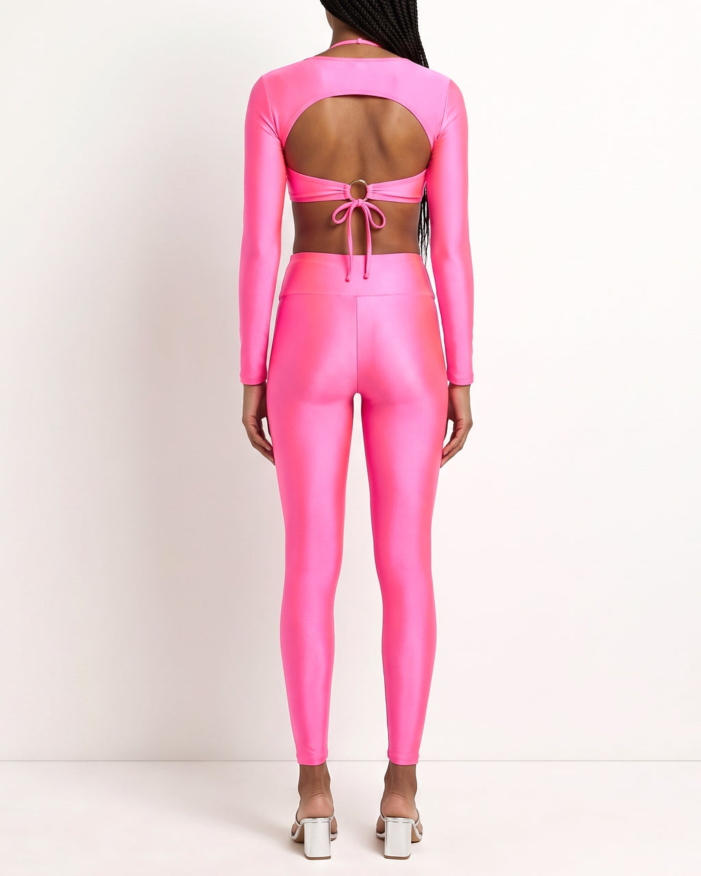Neon pink cutout detailed bodysuit and leggings set, back view on model