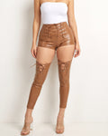 Muvin women's camel lace up detailed cutout faux leather pants, front view on model