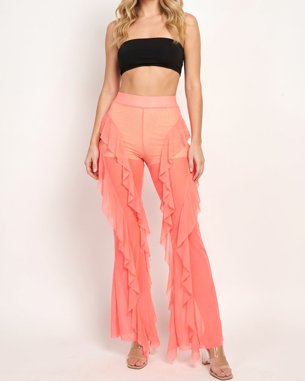 Muvin women's neon coral ruffled mesh cover up pants, front view on model