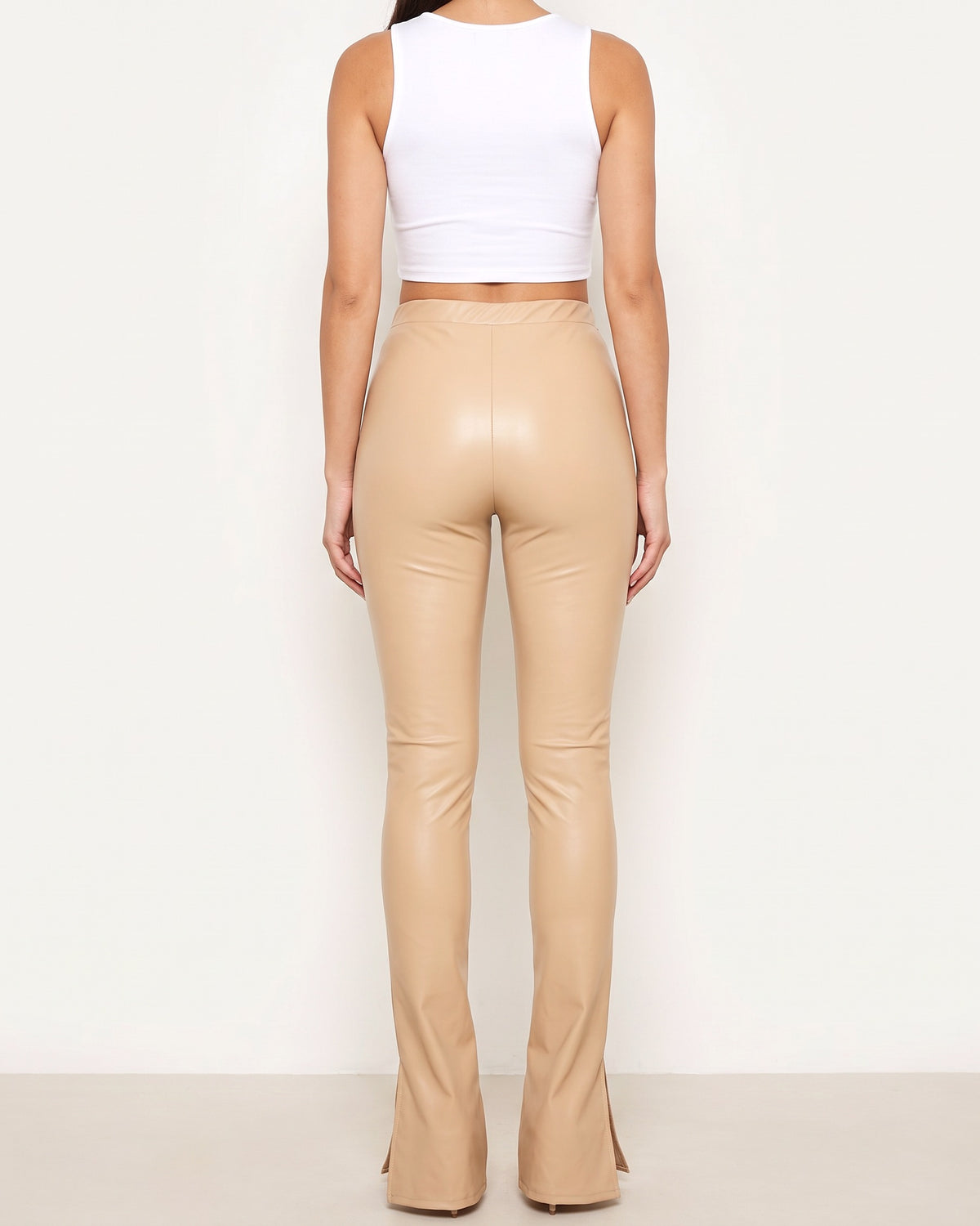 Nude over heel matte PU leggings, back view on model