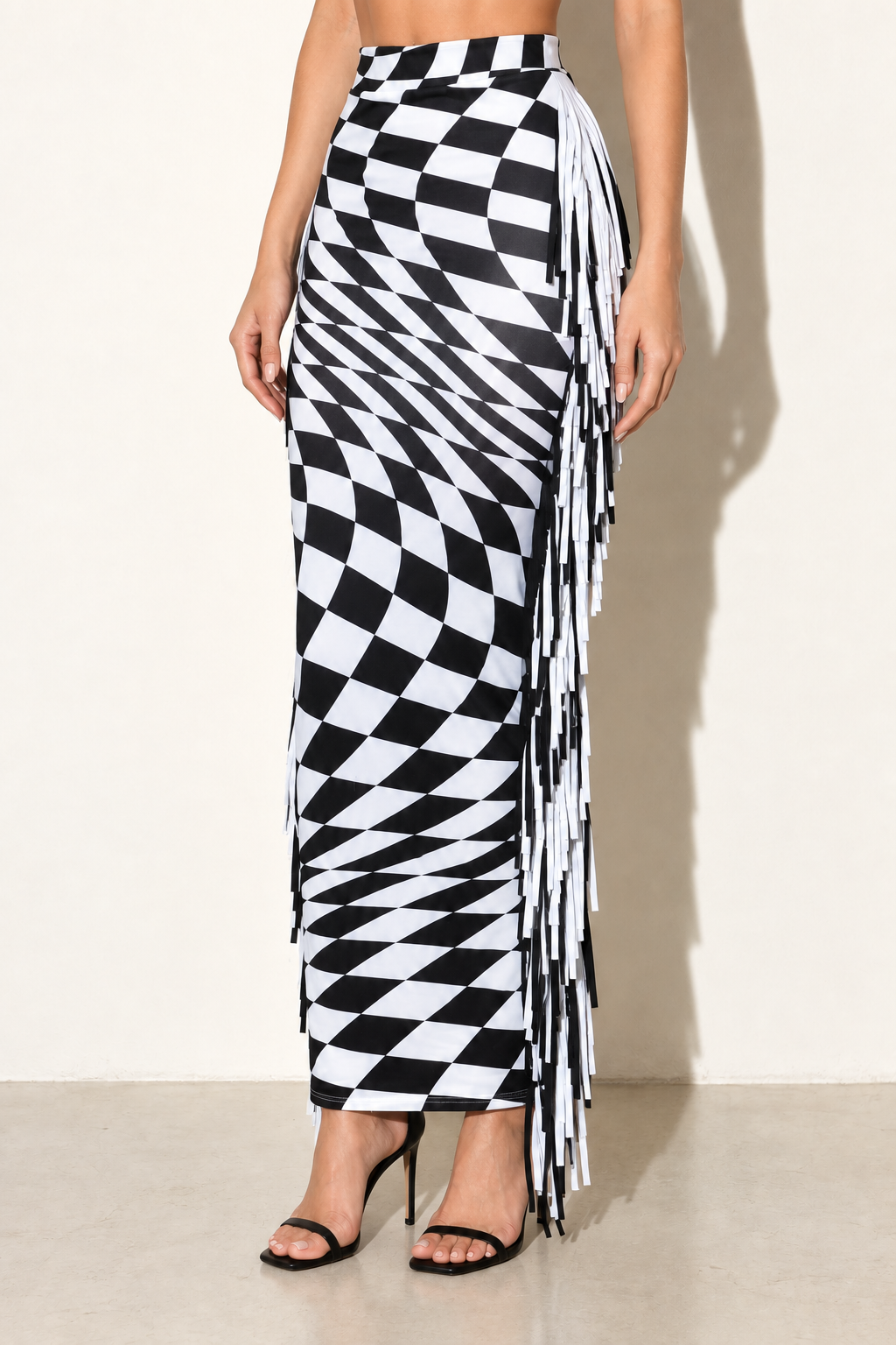 Black and white warped-check fringe maxi skirt, front three-quarter view