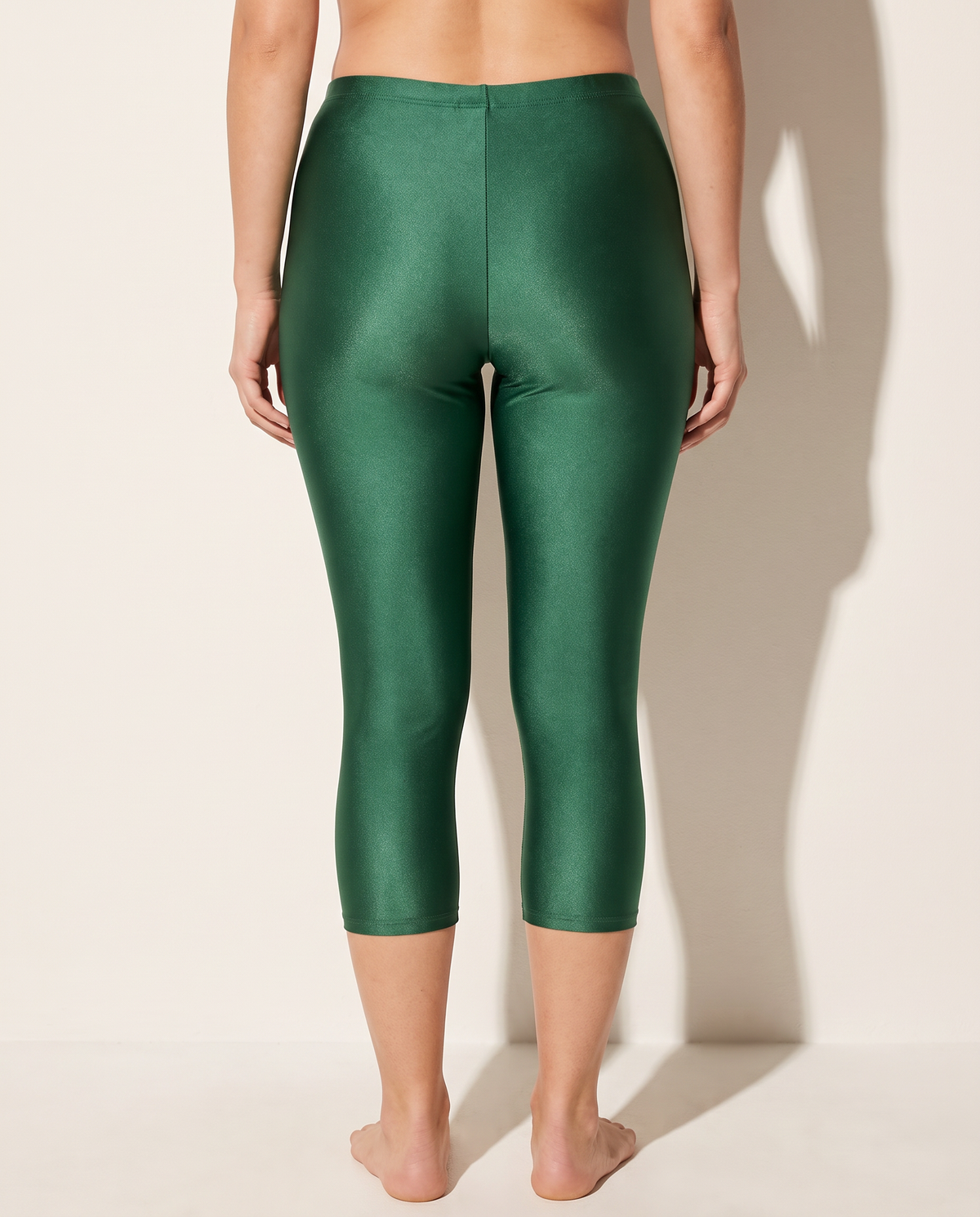 Nylon Capri Leggings in Hunter Green — back view