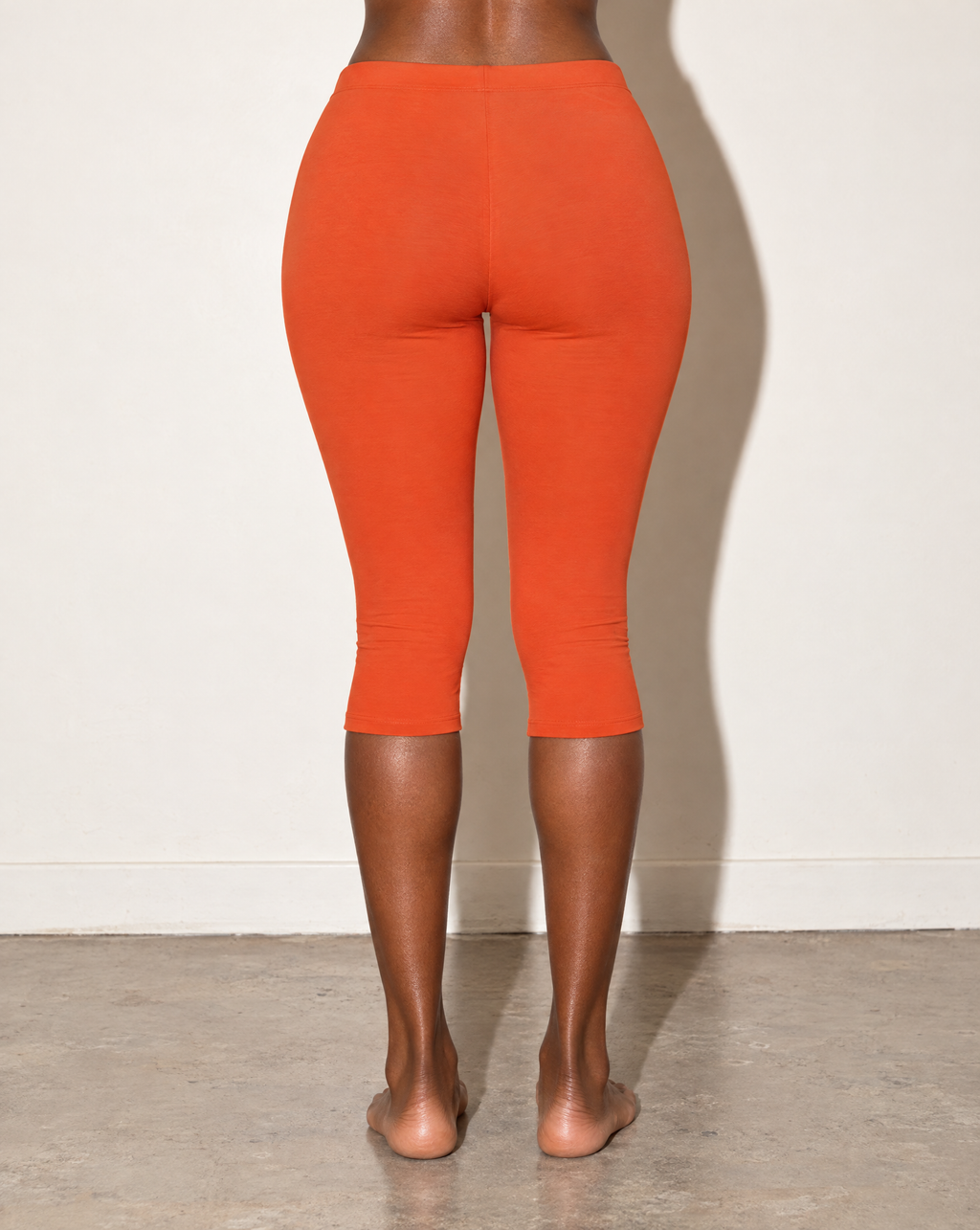 Elevated Basic Solid Capri Leggings in Rust — back view
