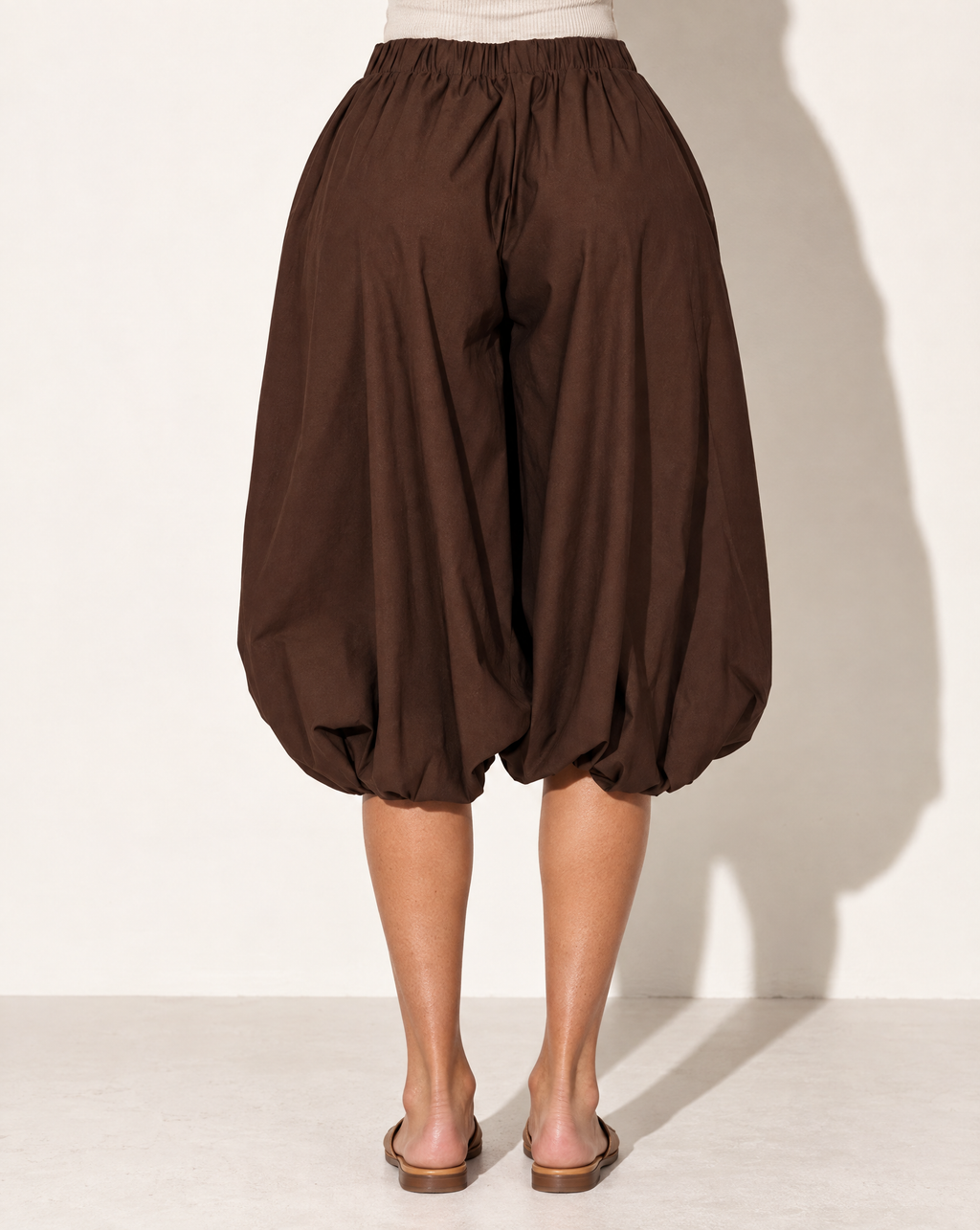 Wide Bubble Hem Capri Pants in Brown — back view