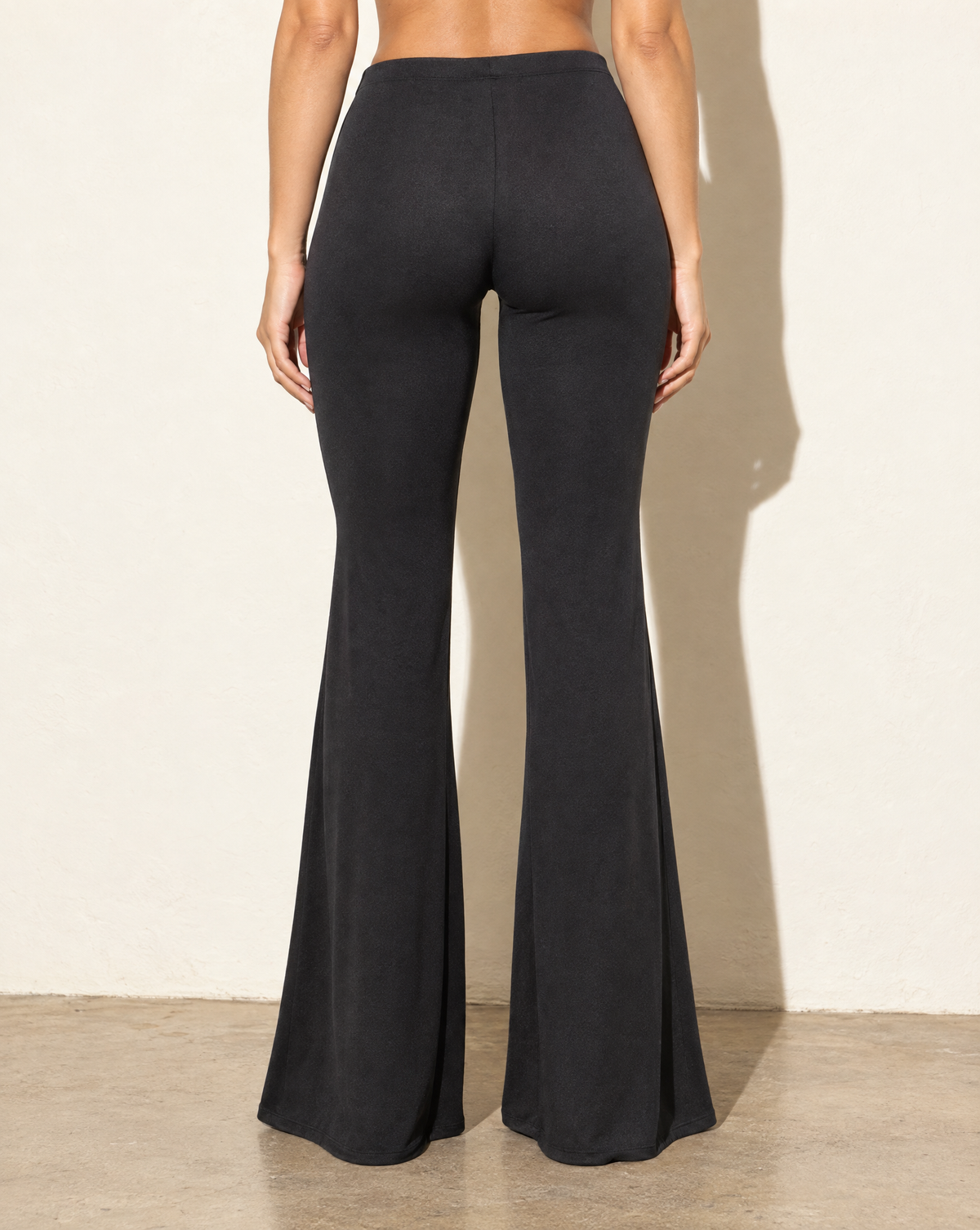 High Waist Flare Hem Pants in Black — back view