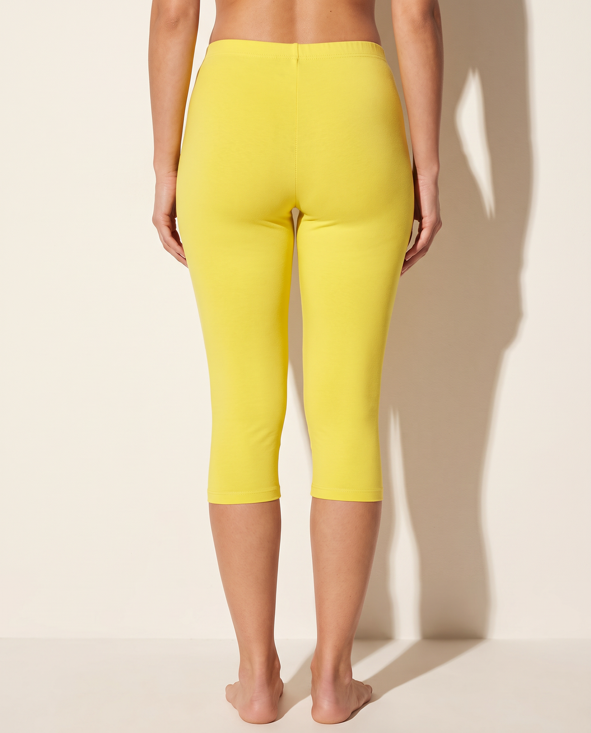 Elevated Basic Solid Capri Leggings in Yellow — back view