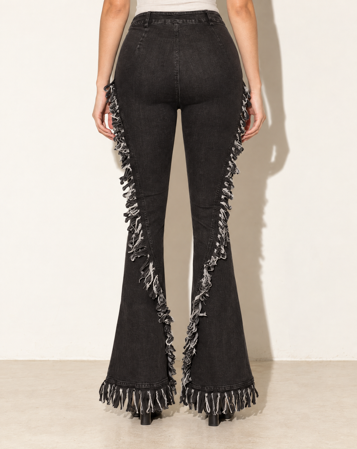 Distressed Fringe Denim Flared Pant in Grey — back view