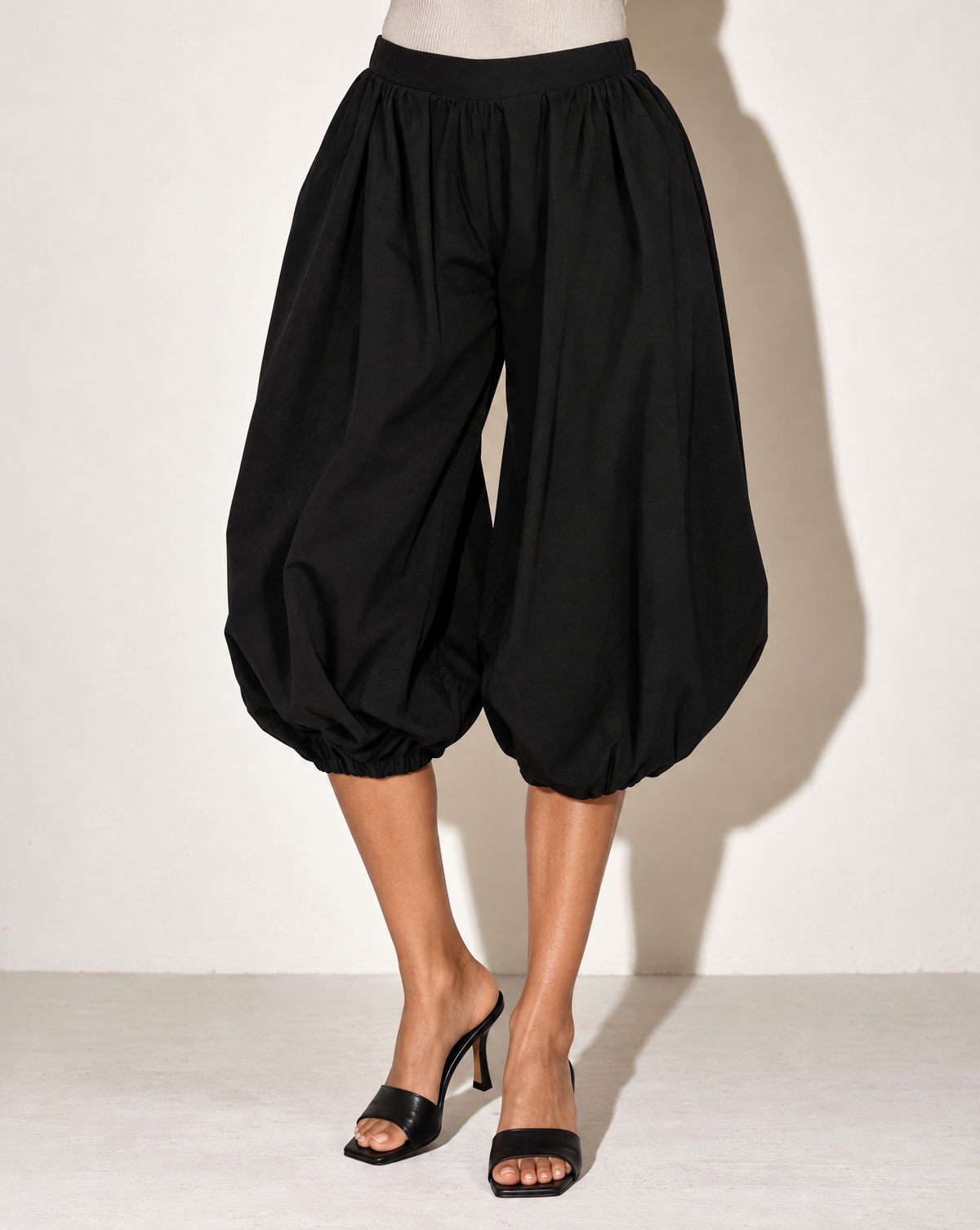Wide Bubble Hem Capri Pants in Black — alternate front view