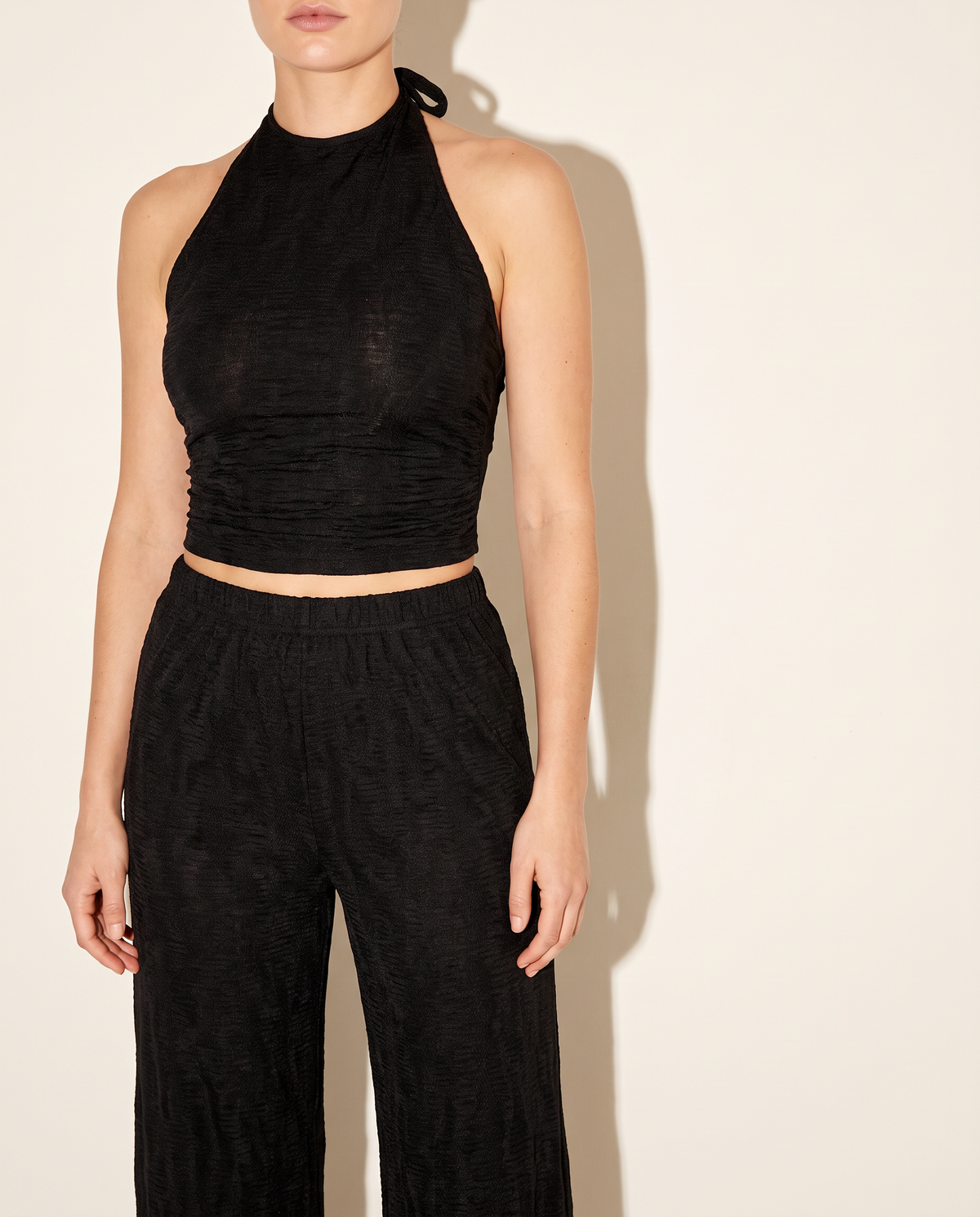 Halter Crop Top & Wide Leg Pants Set in Black — front view