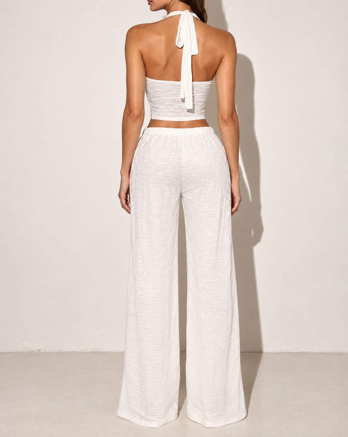 Halter Crop Top & Wide Leg Pants Set in White — back view