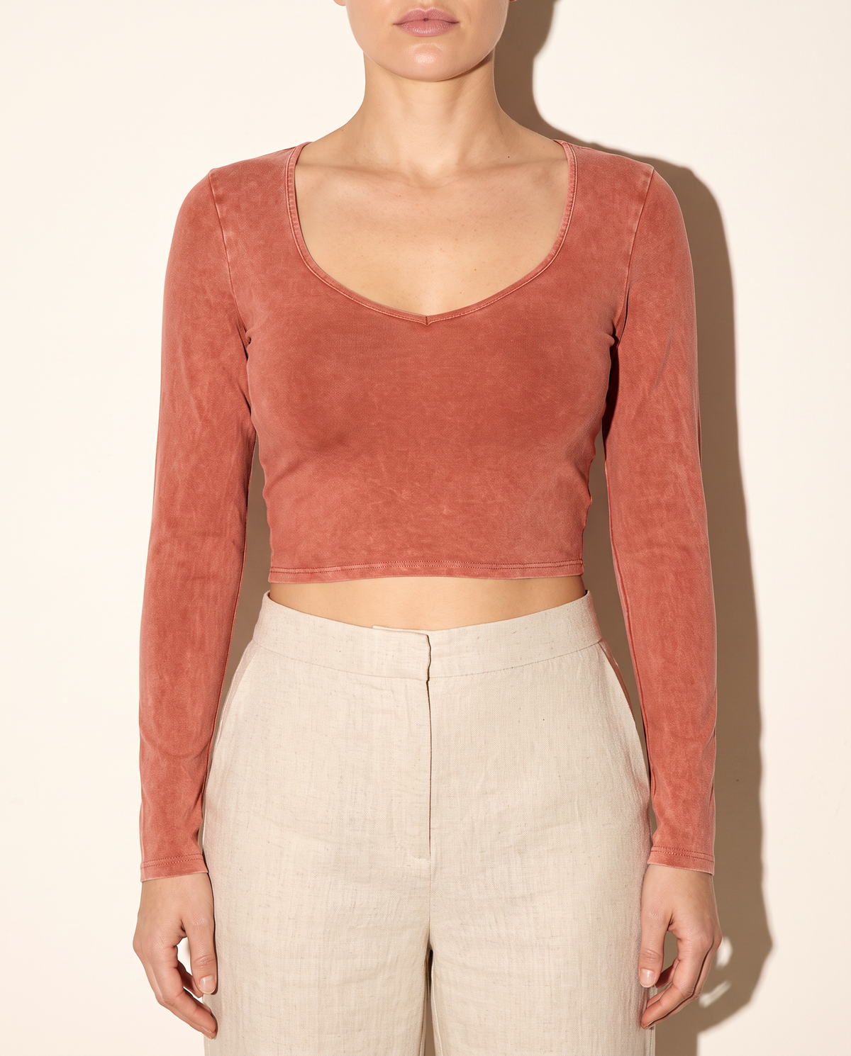 Mineral Washed Long Sleeve Crop Top in Rust — front view